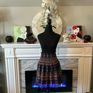 Sui by Anna Sui states XS but smocked waist allows to stretch to 32”-33”